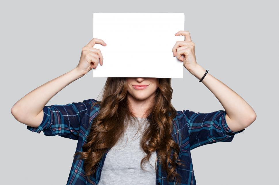 Free Image of Woman obscured by blank white billboard 