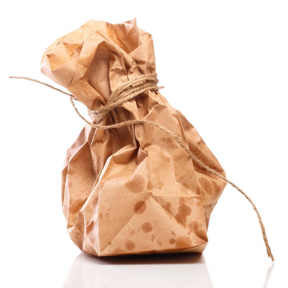 Free Image of Paper bag on the table full of greasy food 
