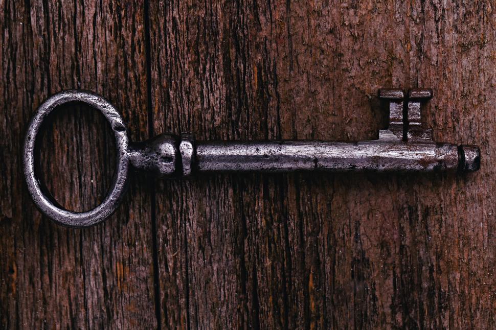 Free Image of Rustic key on weathered wood 