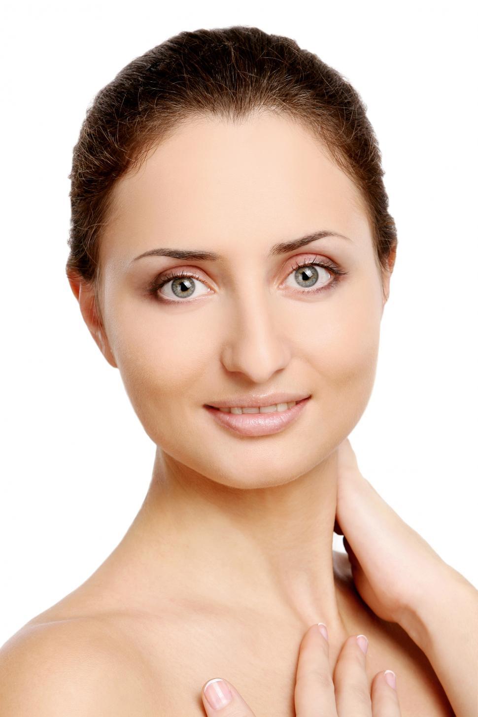 Free Image of young woman looking at the camera on a white background 