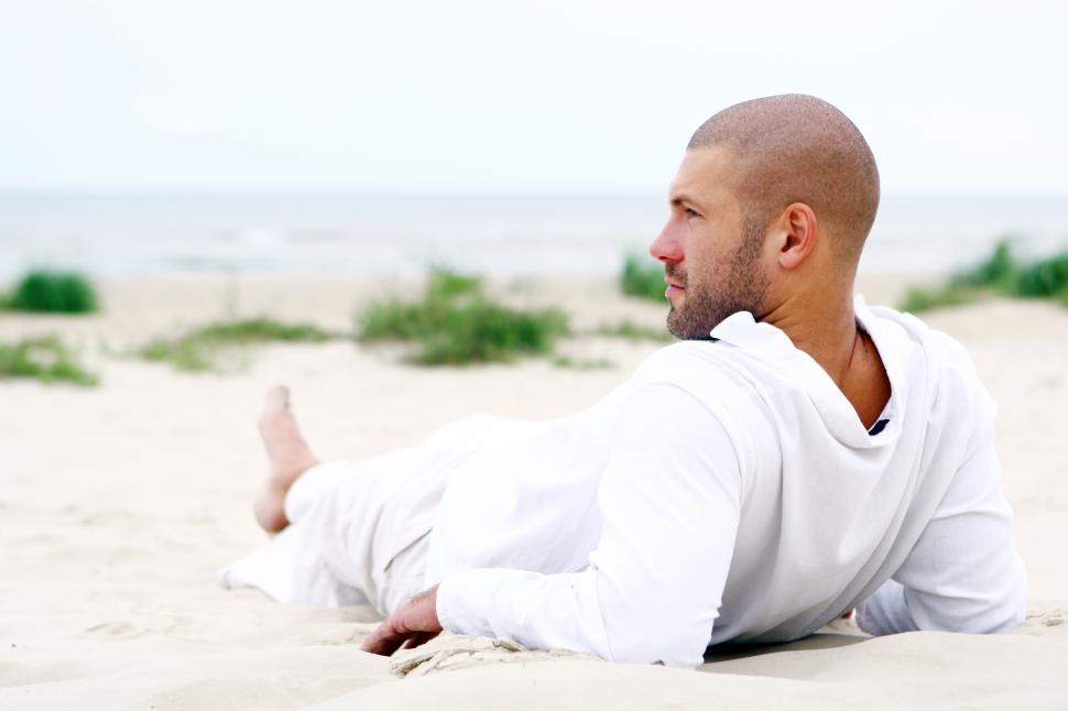 Free Image of Man resting and relaxing at the beach 
