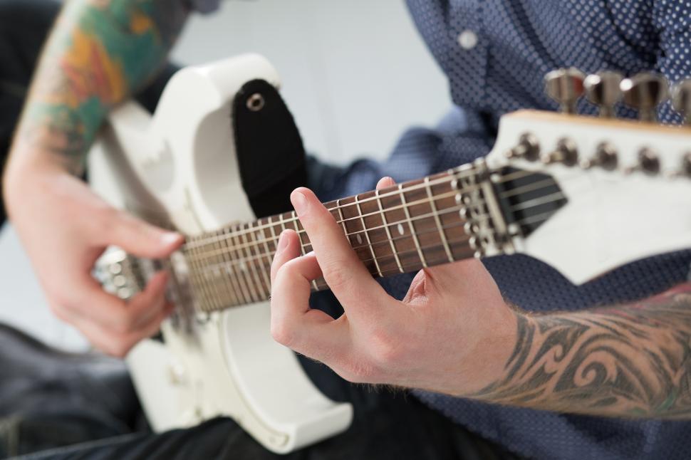 Free Image of Unknown man playing electric guitar 
