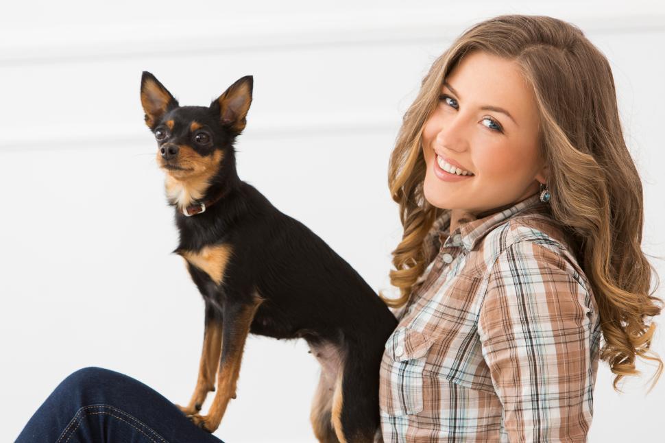 Free Image of Beautiful girl with a small dog 