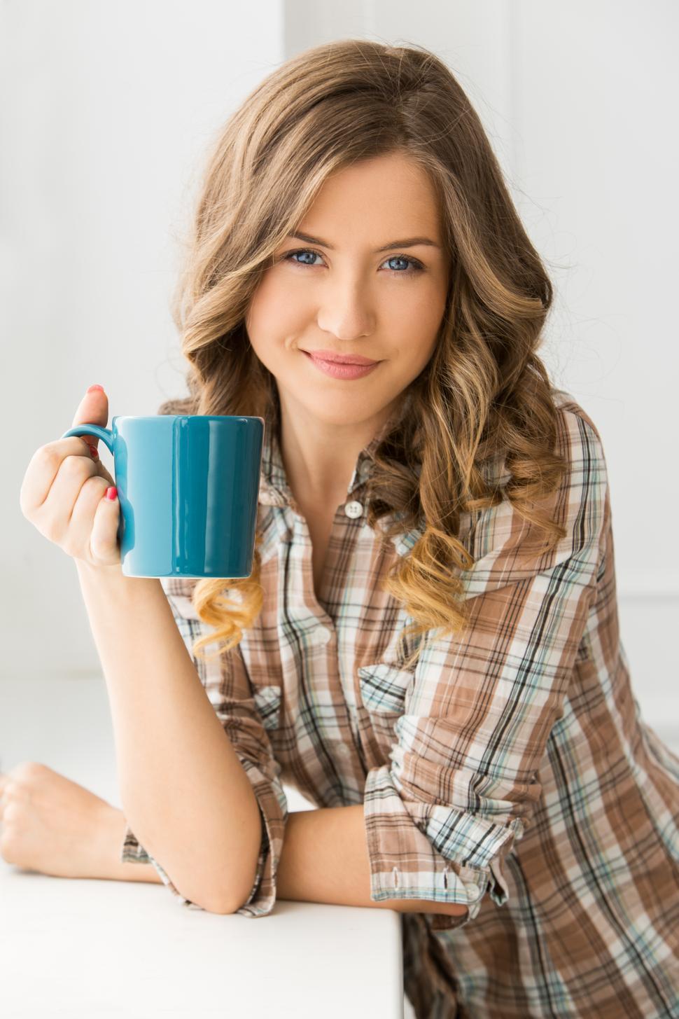 Free Image of Woman with a mug of hot beverage 