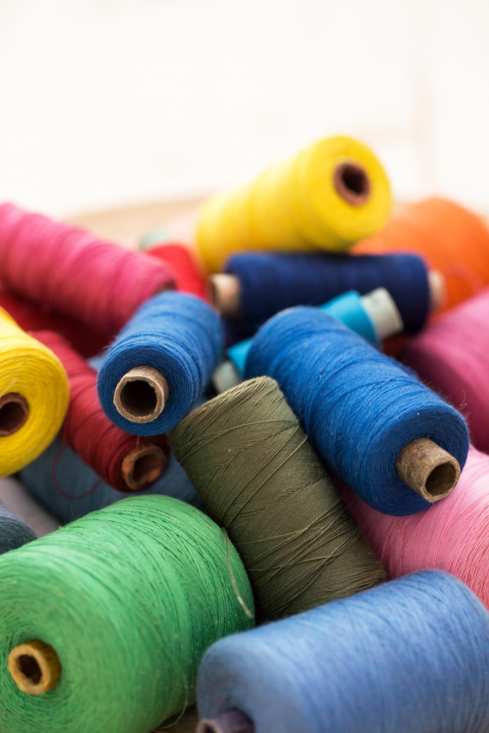 Free Image of Colorful threads on the table 