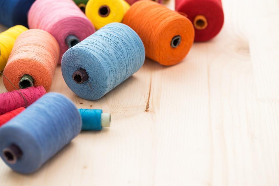 Free Image of Colorful threads on the table with copyspace 