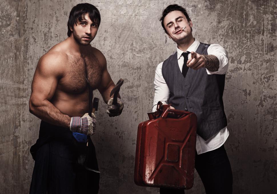 Free Image of Two wild characters of chaos with gas can and weapons 