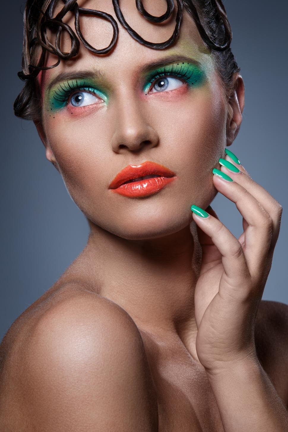 Free Image of Woman with artistic makeup and hair style 