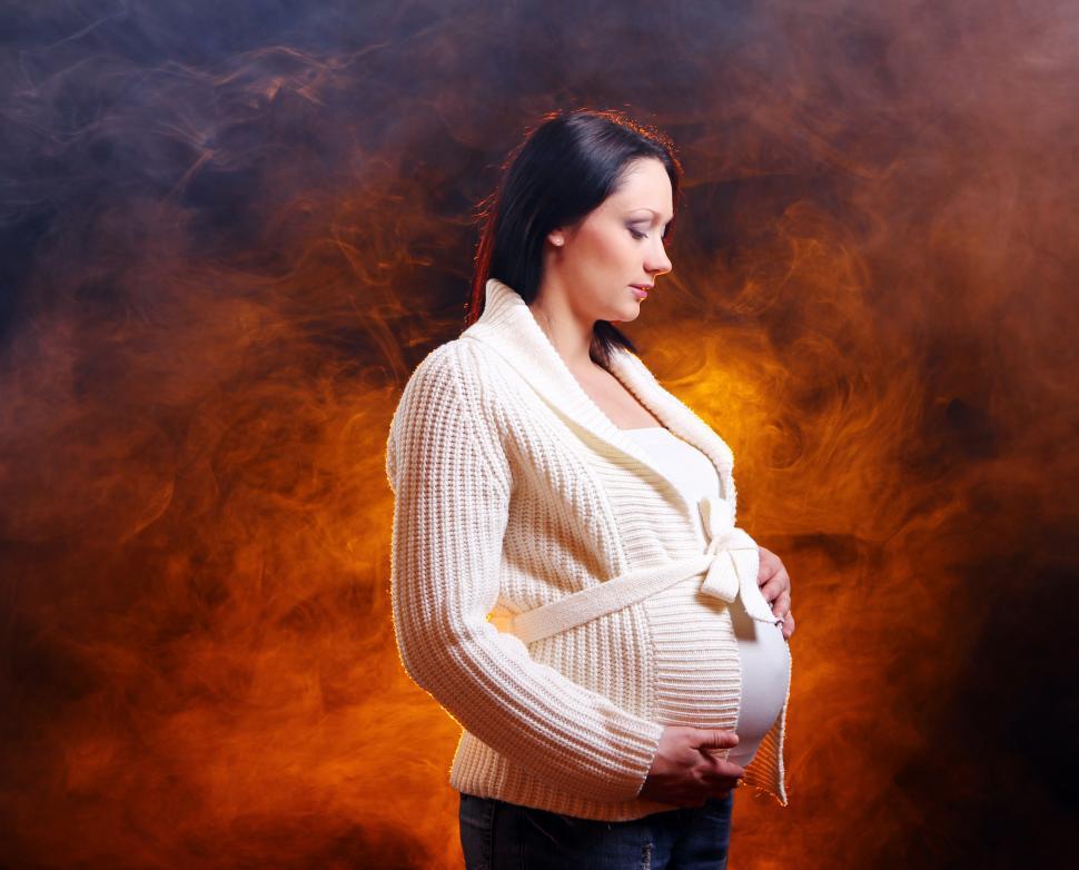 Free Image of Young and beautiful pregnant woman in dramatic background 