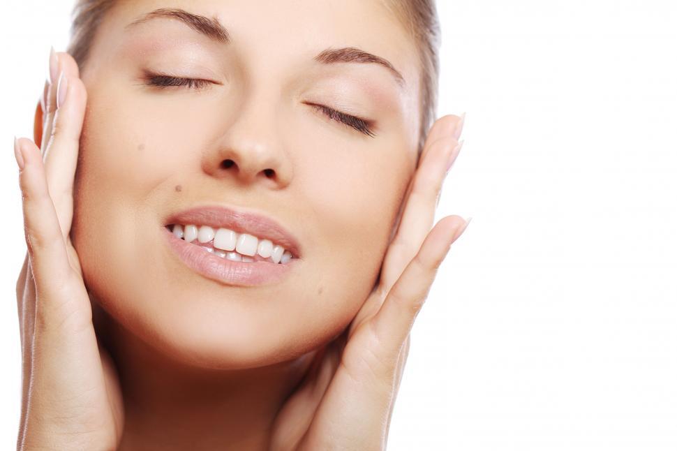 Free Image of Young and beautiful woman, hands at side of face 