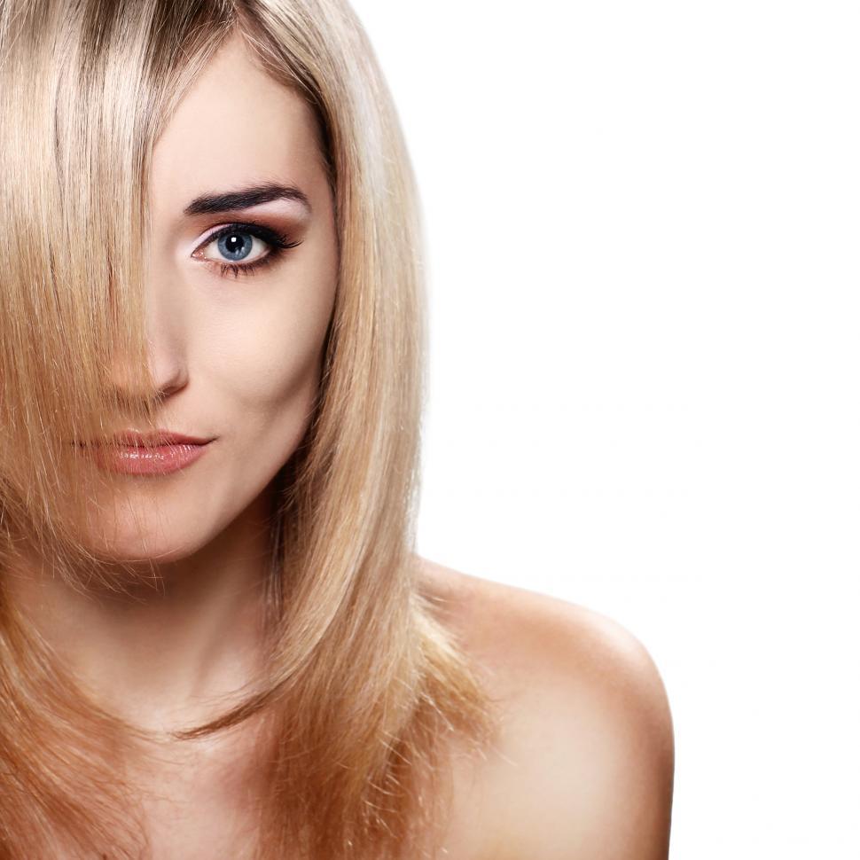 Free Image of Woman with long hair covering one eye on a white background 