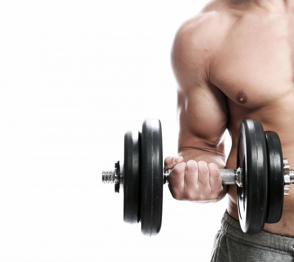 Free Image of Fitness. Man with dumbbell doing a biceps curl 