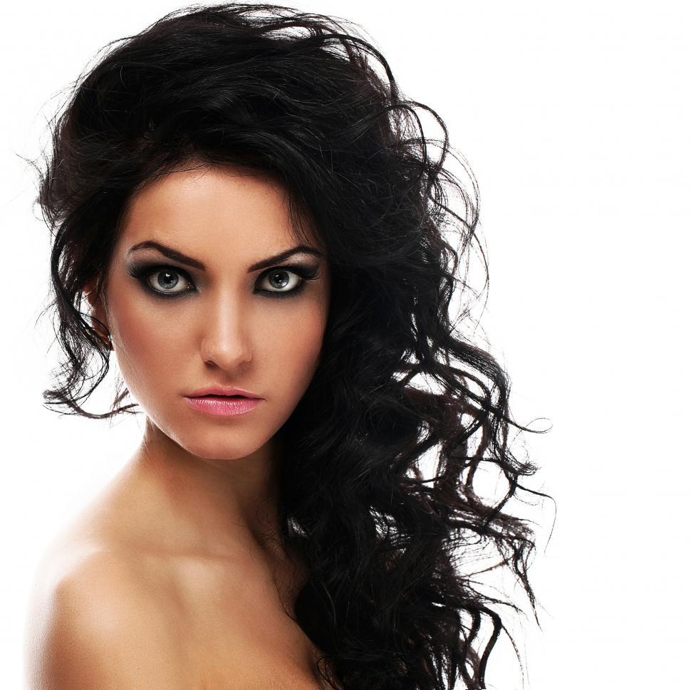 Free Image of Woman with curly dark hair on a white background 
