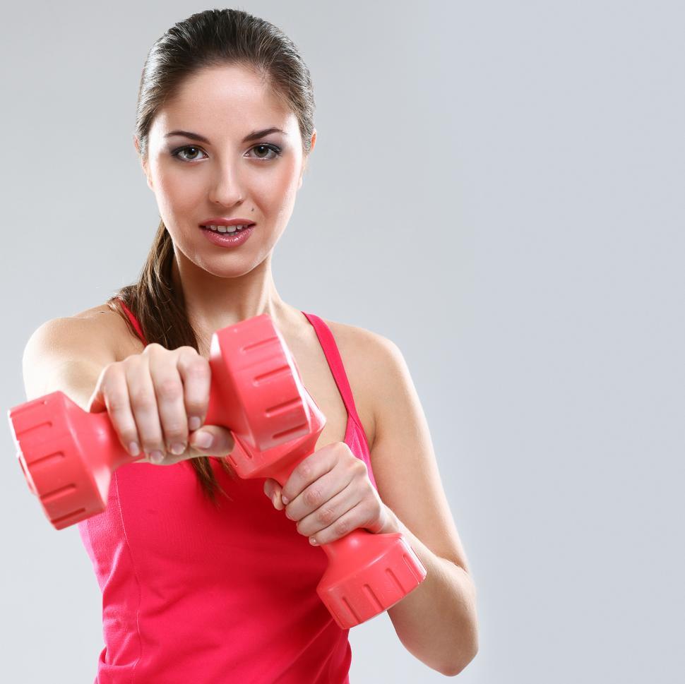 Free Image of Woman during workout with small weights 