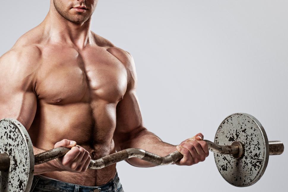 Free Image of Fitness. Man with barbell doing curls 