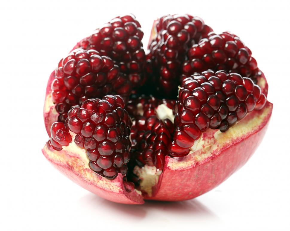 Free Image of One peeled pomegranate on white background 