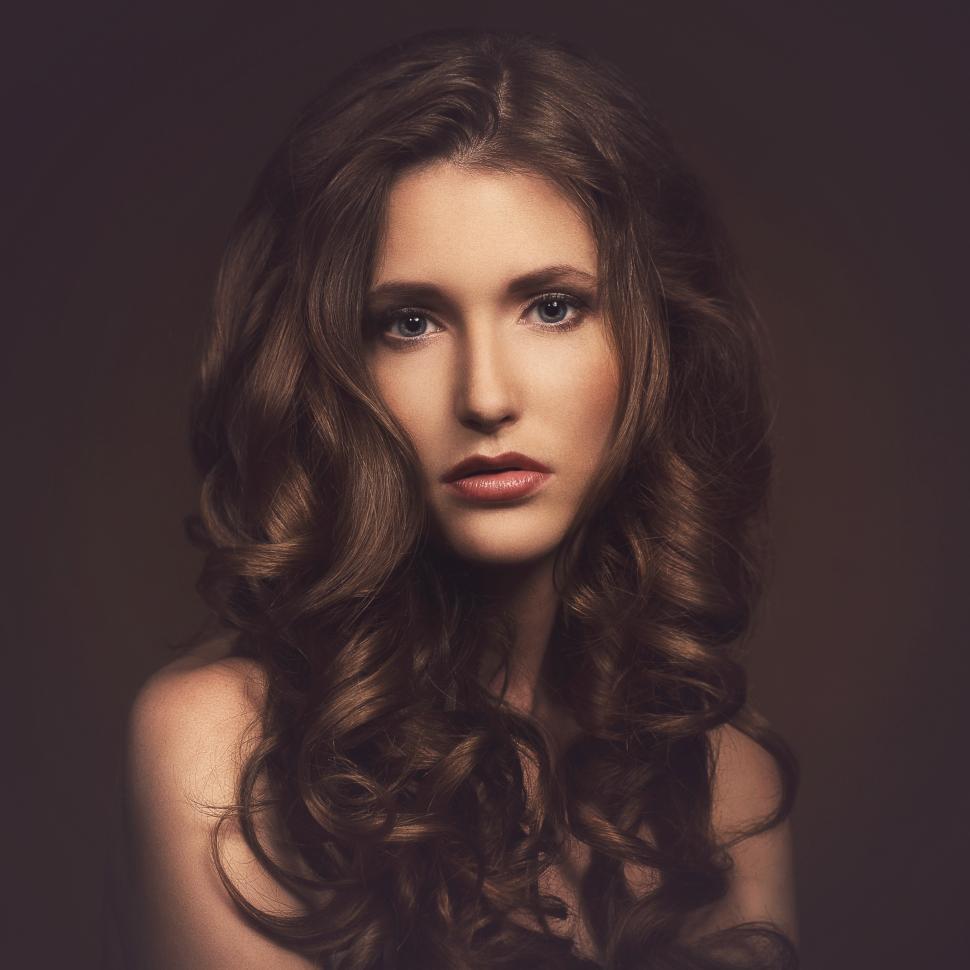 Free Image of Beautiful girl with curled hair, dark look 