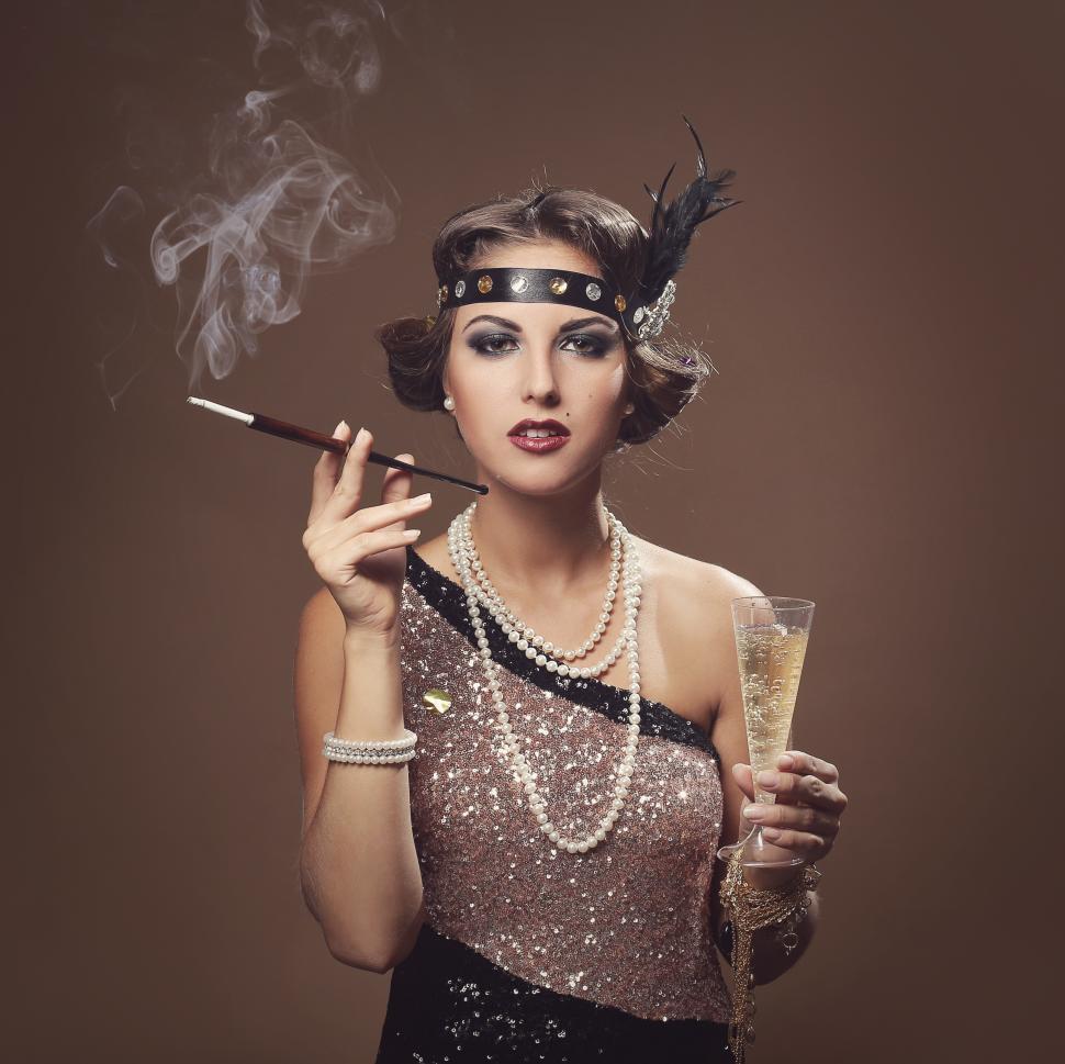 Free Image of Beautiful girl smoking, with glass of champagne 