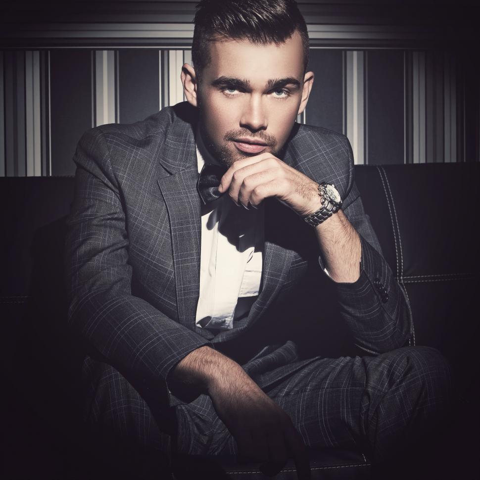Free Image of Handsome man in a suit looking at camera 