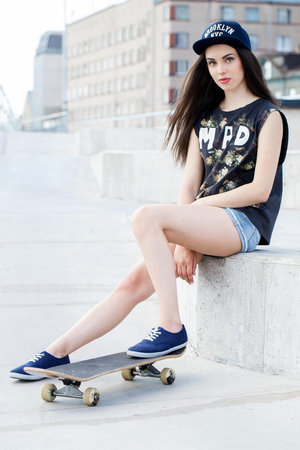 Free Image of Young girl in the city with skateboard 