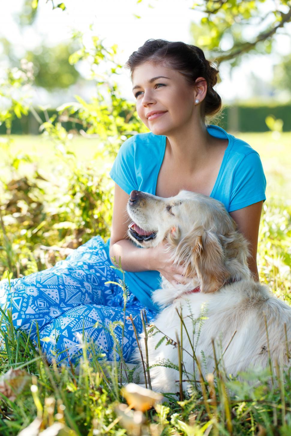 Free Image of Young woman with her dog companion 