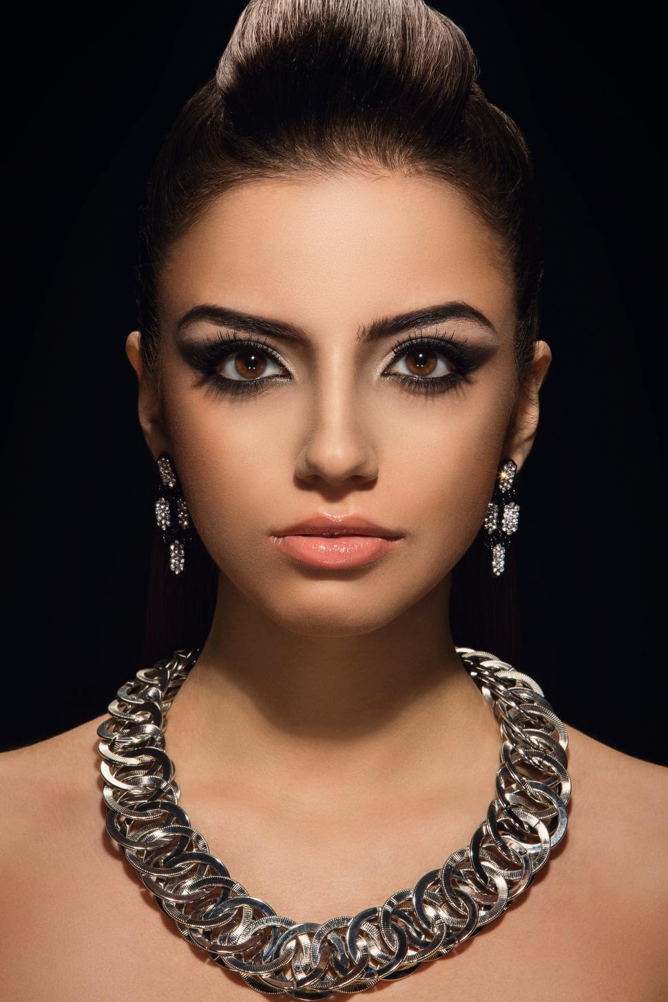 Free Image of Vogue. Woman with beautiful necklace in dramatic light 