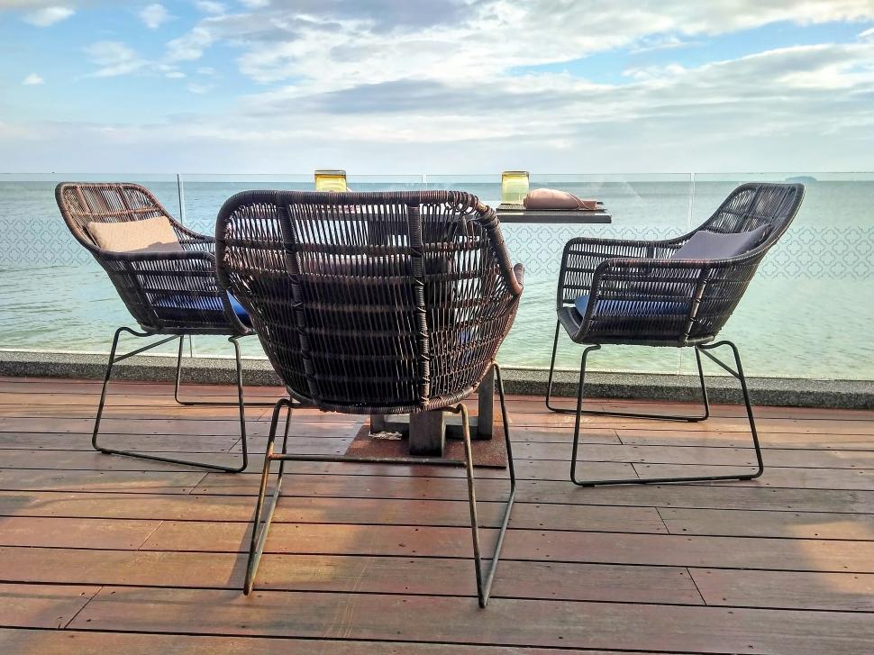 Free Image of Restaurant Table and Chairs by Ocean  