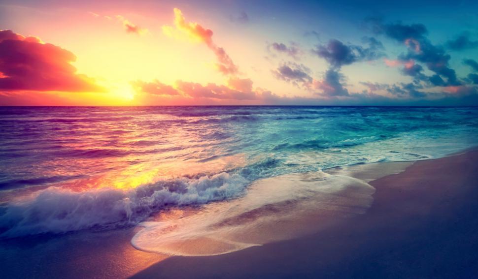 Free Image of Bright Colorful Sunset on the Beach - Hazy Looks 