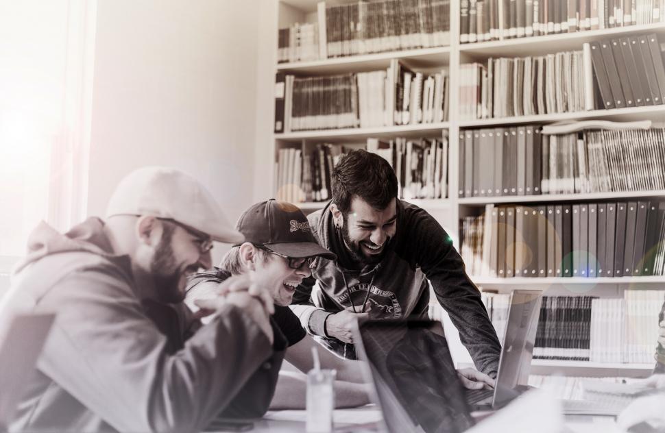 Free Image of People At the Office Talking and Smiling 