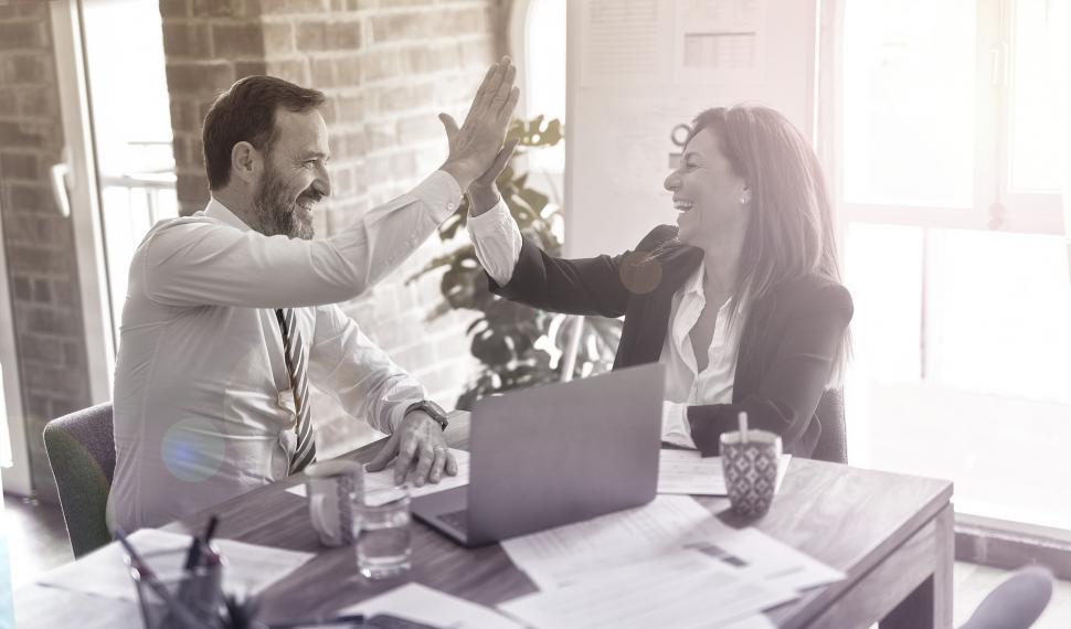 Free Image of Business Agreement - Business Plan - Man and Woman High-Fiving 