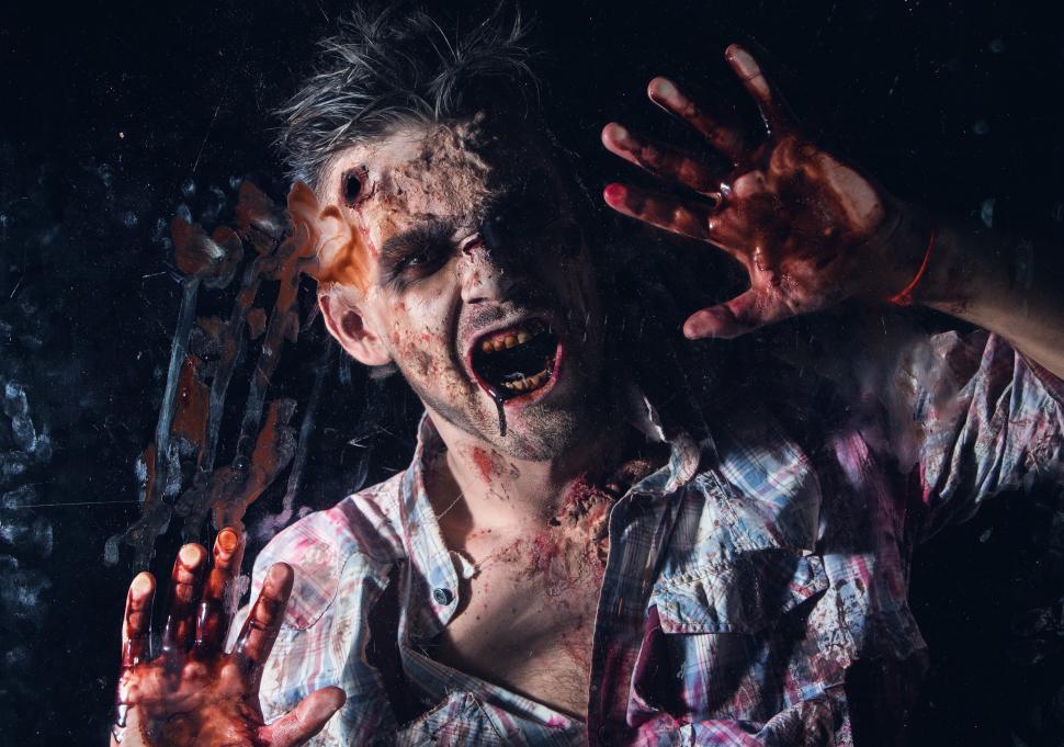 Free Image of Scary zombie at the window cosplay 