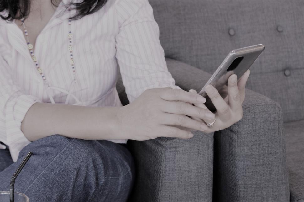 Free Image of Woman uses a Smartphone  