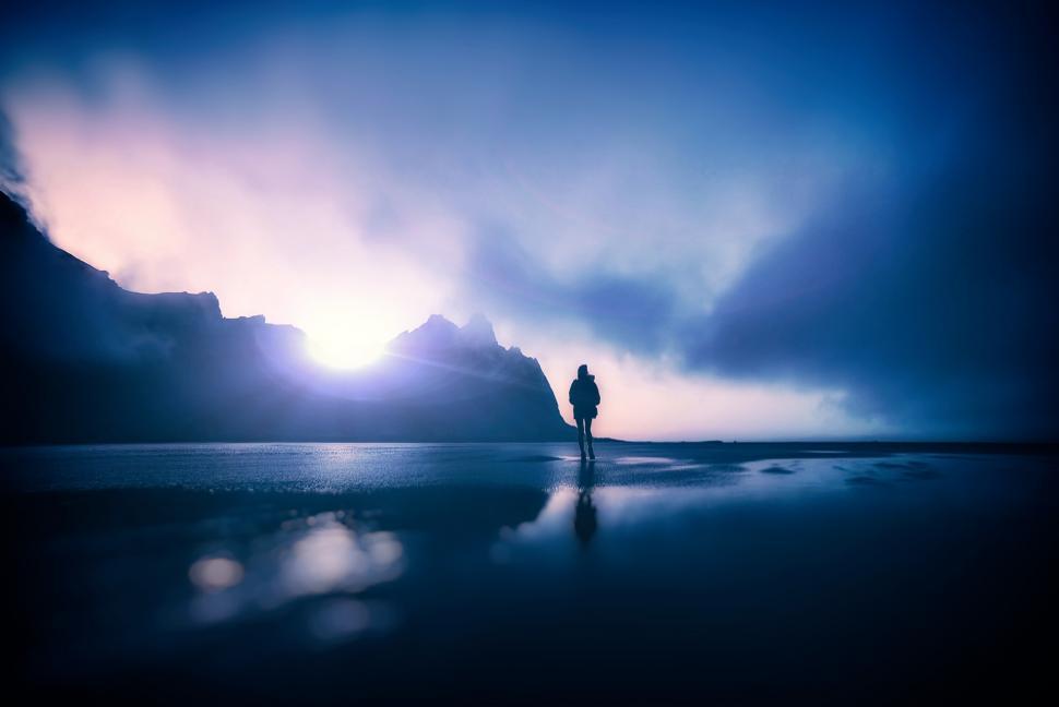 Free Image of Hiker Alone on Dark Foggy Beach 