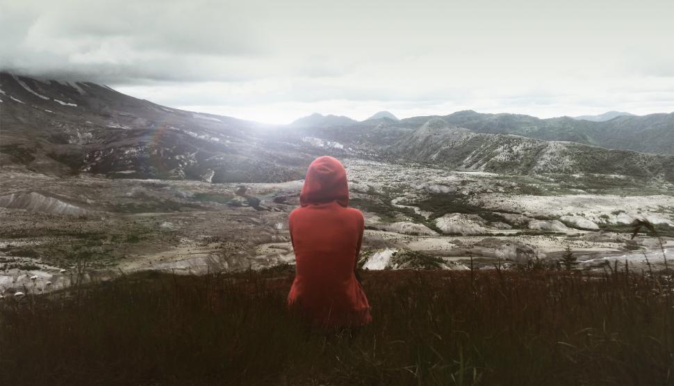 Free Image of Hiker Sitting on Grass Enjoying the Solitude 