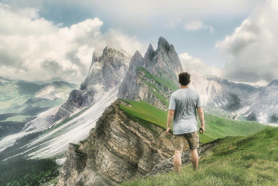 Free Image of Lone Hiker Looking at Mountain Summit - Great Outdoors 