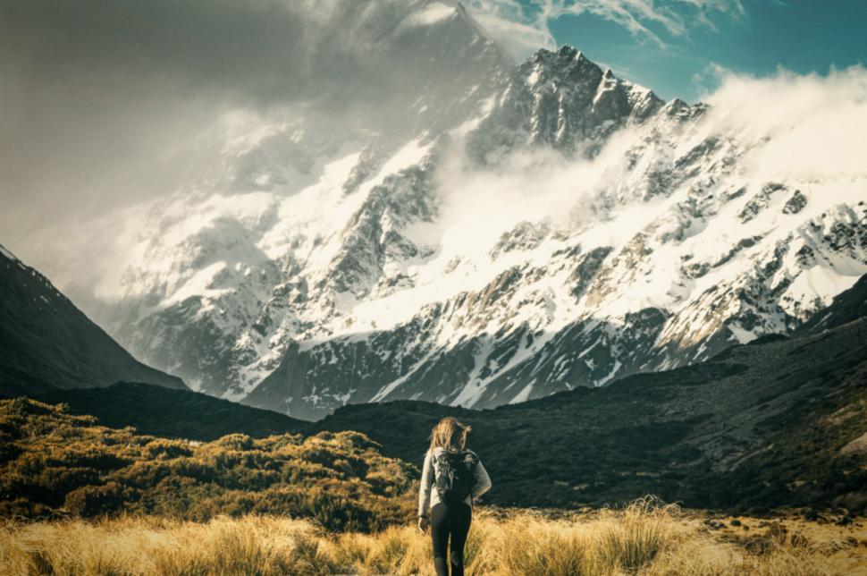 Free Image of Facing the Mountain - Hiker Approaching Imposing Mountain 