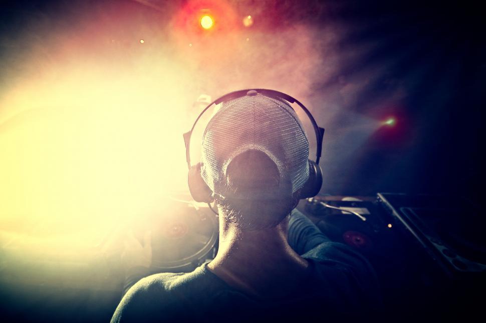 Free Image of DJ Mixing Music at a Club - Hazy Looks 