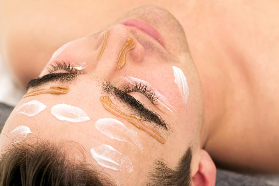 Free Image of Man with facial moisturizer 