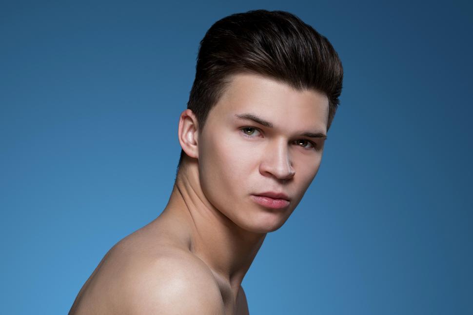 Free Image of Clean cut man on blue background 