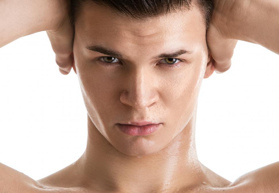 Free Image of Intense man with hands on head 