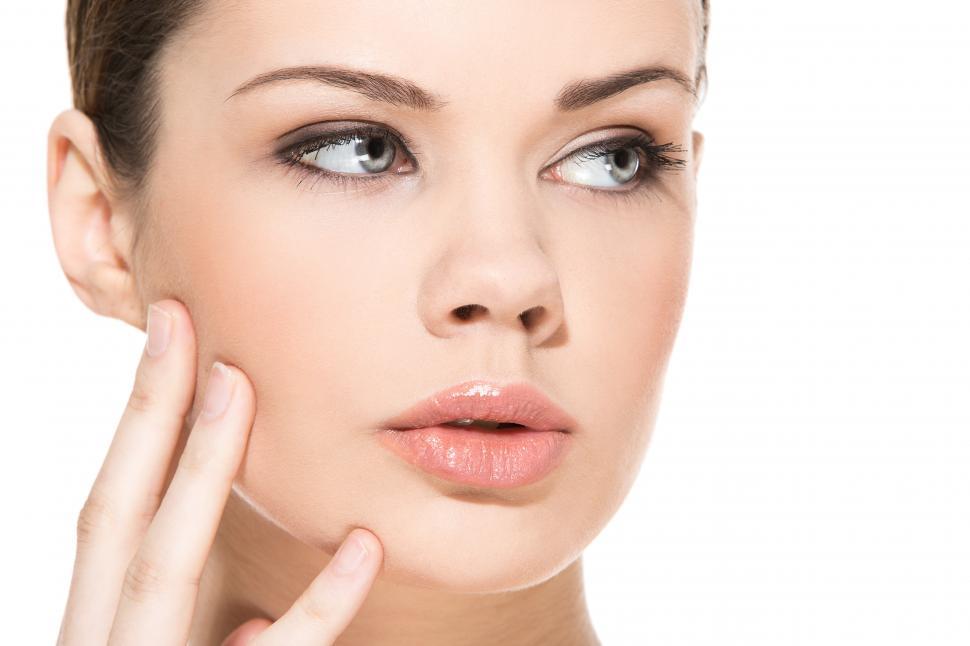 Free Image of Model with clear skin, looking off frame 