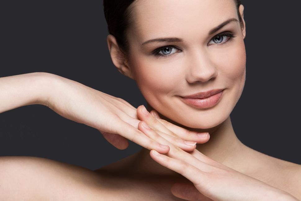 Free Image of Smiling woman with hands together, looking at camera 