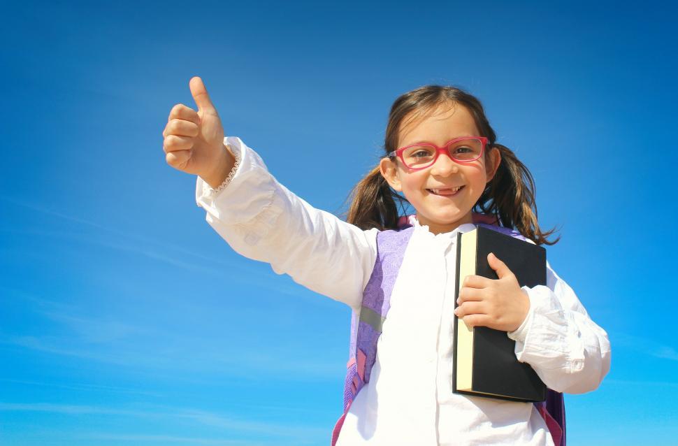 Free Image of Portrait of Cute Little Girl with Book and Backpack - Education 