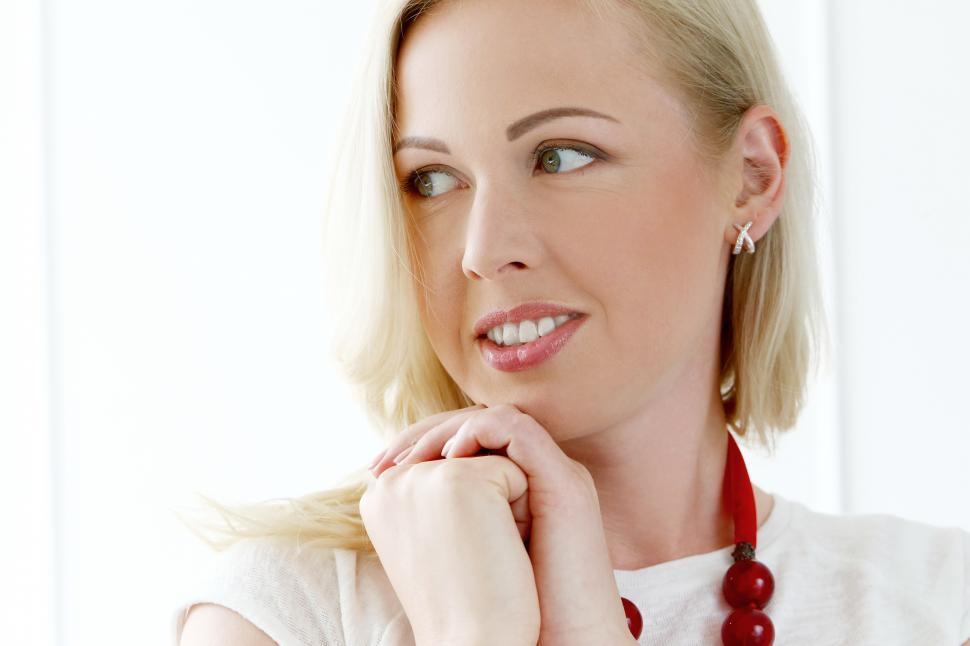 Free Image of Blonde woman with hands clasped 