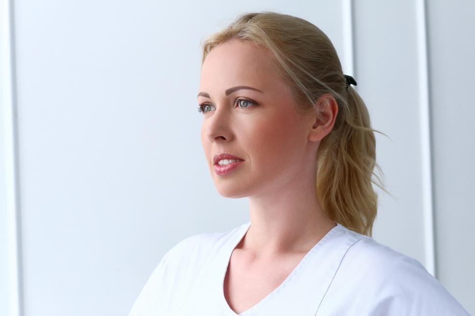 Free Image of Young professional woman in a white office 