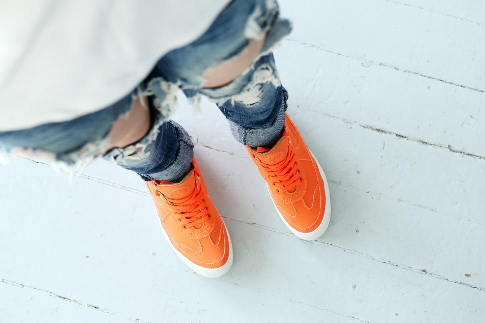 Free Image of Girl in torn denim jeans 