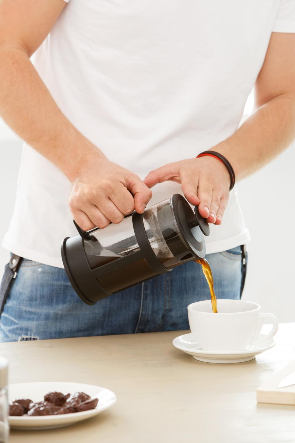 Free Image of Home, morning. Pouring morning coffee 