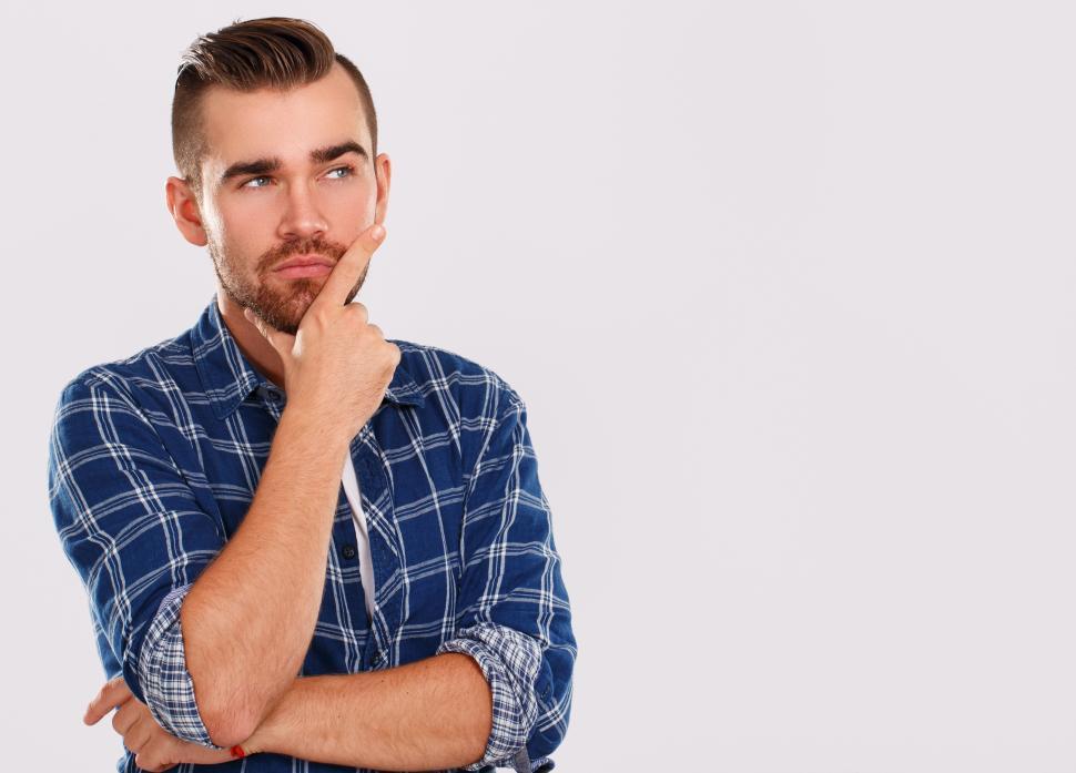 Free Image of Emotions. Young man in blue shirt, pondering. Copyspace. 