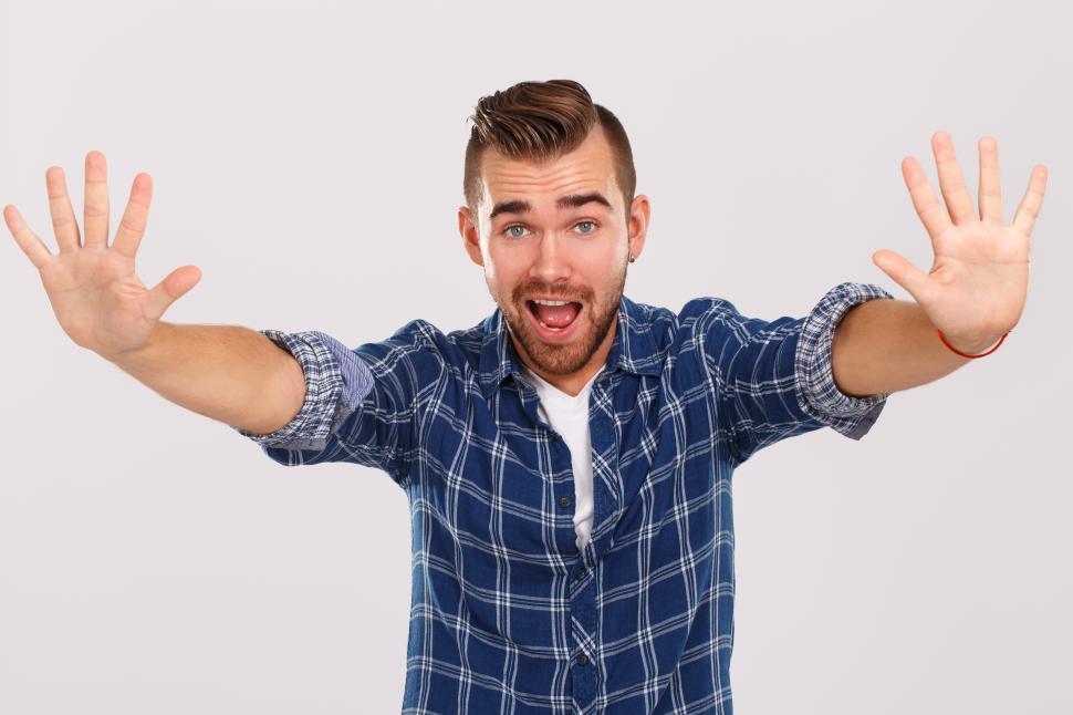 Free Image of Emotions. Young man holding two hands - Stop 