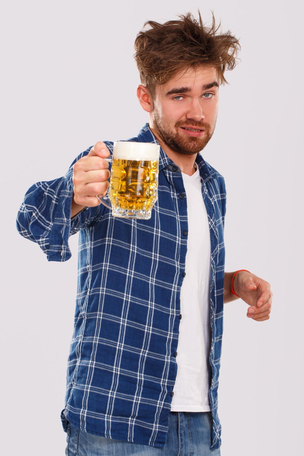 Free Image of Alcohol. Guy in blue shirt has been drinking for a while. 